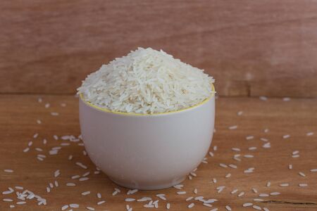 White long rice background, uncooked raw cereals, macro closeupの写真素材