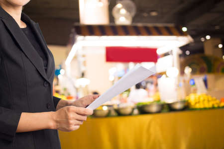 Businesswoman reading a business document.
