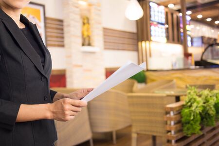 Businesswoman reading a business document.の写真素材