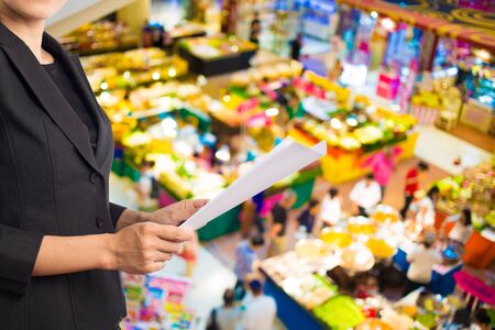 Businesswoman reading a business document.の写真素材