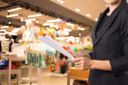 Businesswoman reading a business document.の写真素材