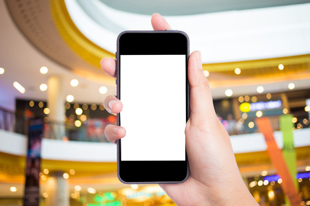 Photo blank. Women hand holding blank mobile smart phone in the shopping mall.の写真素材