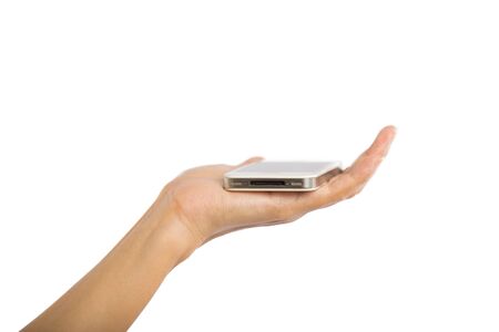Human hand holding blank mobile smart phone isolated on white の写真素材