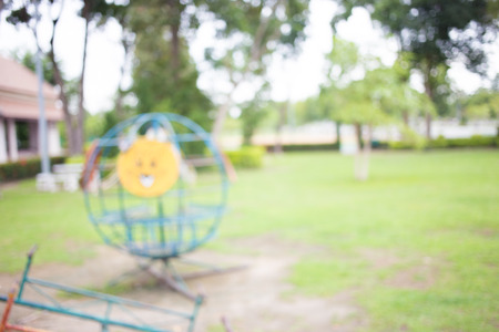 Defocused and blur image of children's playground at public park for background usage.