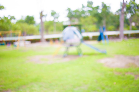 Defocused and blur image of children's playground at public park for background usage.の写真素材