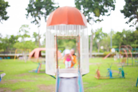 Defocused and blur image of children's playground at public park for background usage.の写真素材