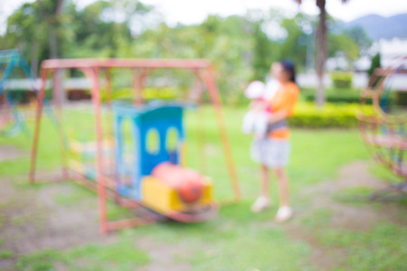 Defocused and blur image of children's playground at public park for background usage.の写真素材