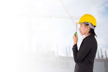 Worker and the blurred construction in background with space for your textの写真素材