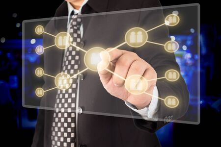 businessman hand pressing social network icon