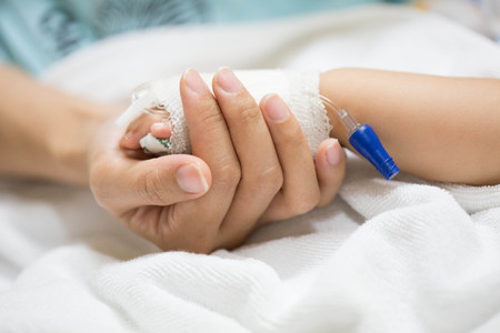 Mother holding a baby hand.の写真素材