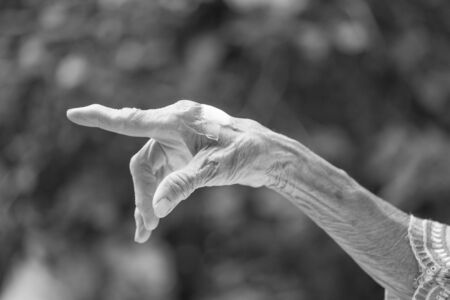 Hands of the old woman.  Black and White.