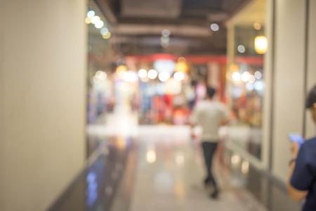 People in motion in escalators at the modern shopping mall.の写真素材