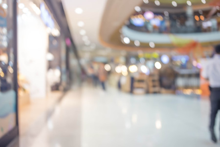 People in motion in escalators at the modern shopping mall.の写真素材