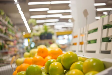 Blurred image of shopping mall aisle and shelves.の写真素材