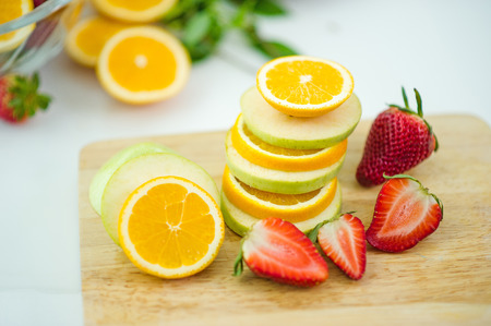 The fruits of health lover Healthy fruit And health care to eat healthy food. To the skin. The fruit is placed in a beautiful table, apple apricot, banana, orange, dragon, placed in the corner of the view.の写真素材