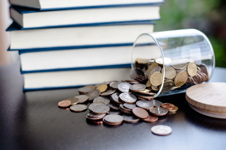 Money Saving Money Saving Ideas Save money, preset ideas by hand, put money in the money stack business.の写真素材