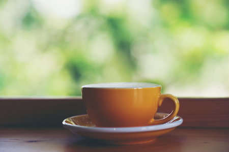 Hot coffee is placed in the same table in the morning of every day. Coffee at coffee neck all have to eat regularly.の写真素材