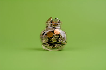 Savings in a glass bottle; savings; salary; income from work savings concept