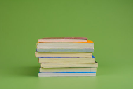 Books. Stack of books stacked on light green background. Reading. Reading concept. and collection of booksの写真素材