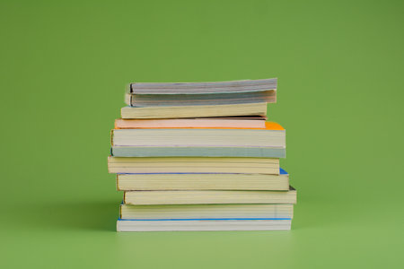 Books. Stack of books stacked on light green background. Reading. Reading concept. and collection of booksの写真素材