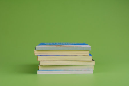 Books. Stack of books stacked on light green background. Reading. Reading concept. and collection of booksの写真素材