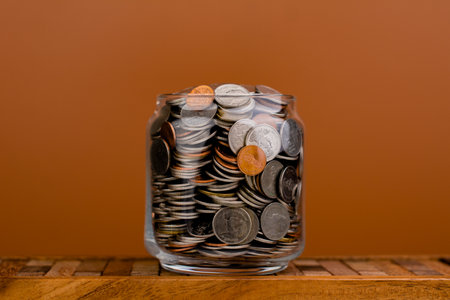 Coin money in a glass jar. Saving money. Money saving concept. coin collection