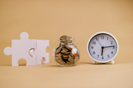Coin money in a glass jar. Saving money. Money saving concept. coin collectionの写真素材