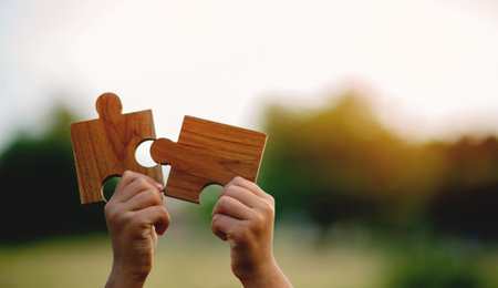 puzzle piece in hand Power with your own hands Communication jigsaw unity teamworkの写真素材