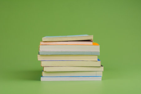 Books. Stack of books stacked on light green background. Reading. Reading concept. and collection of booksの写真素材