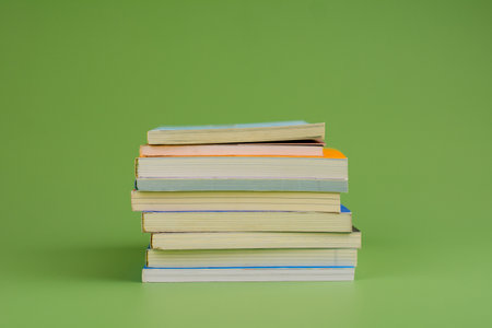 Books. Stack of books stacked on light green background. Reading. Reading concept. and collection of booksの写真素材