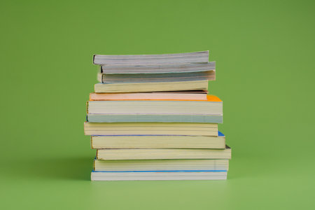 Books. Stack of books stacked on light green background. Reading. Reading concept. and collection of booksの写真素材