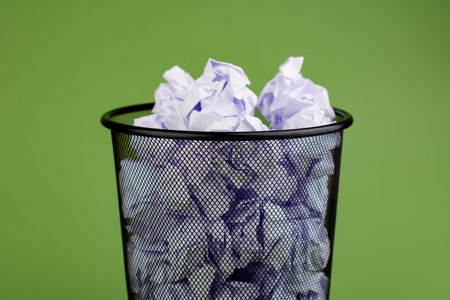 Garbage bin. Full waste paper bin. Garbage disposal. Throwing waste to the right place concept.の写真素材