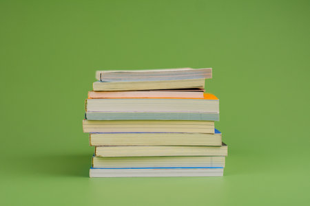 Books. Stack of books stacked on light green background. Reading. Reading concept. and collection of booksの写真素材