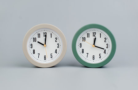 Alarm clock on gray scene, time concept operation of time When it's important to work and liveの写真素材