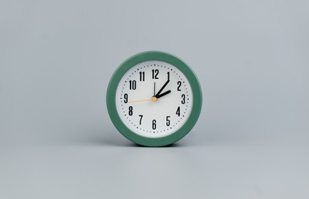 Alarm clock on gray scene, time concept operation of time When it's important to work and liveの写真素材