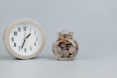 coin in glass jar saving money coin coin bank income wages expenditure money financial stabilityの写真素材