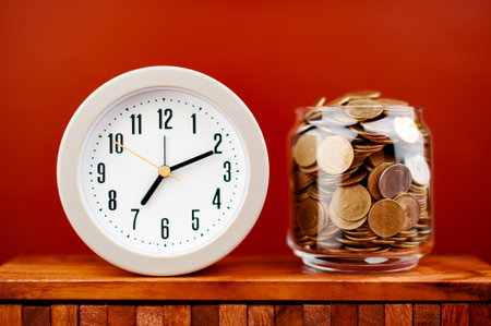 coin in glass jar saving money coin coin bank income wages expenditure money financial stabilityの写真素材