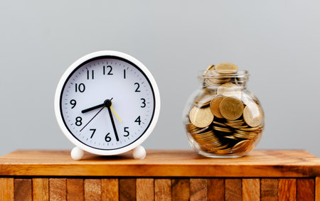 Coin bank, money and time, saving money on time, earning, income, wages, savings concept.の写真素材