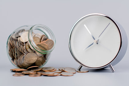 Money coins. Saving coins in a glass jar. Coin bank, finance and financial investment Cash loans,...