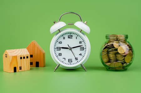 Money, house and time Cash loans, home loans, real estate Finance and financial investment, coin bank, salary, wages, cash flowの写真素材