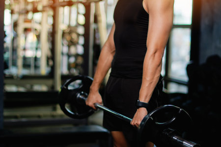 Exercise with dumbbells Lift weights to build strong arm muscles, an activity for good physical health.の写真素材