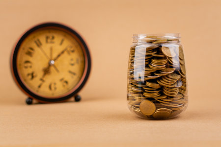 Saving coins in a glass jar, planning your finances, creating a good financial path. Financial and...