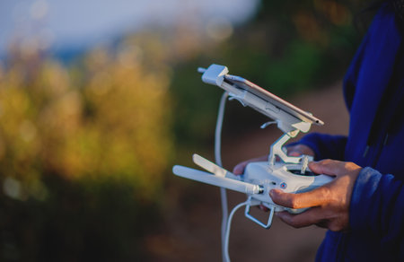 Drones take aerial photos of tourists and professional photographers. Flying photography equipment.