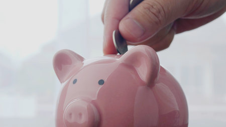 Saving money in a piggy bank, planning finances and making good financial investments, income from...