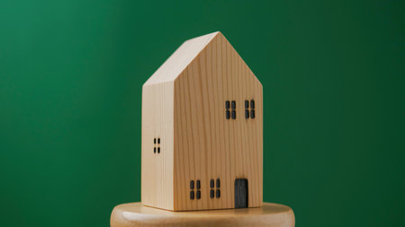 Wooden house model for home loans and cash, house projects, rental rooms and mortgage loansの写真素材