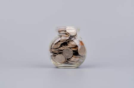 Saving coins, accumulating money for investment and a good future retirement