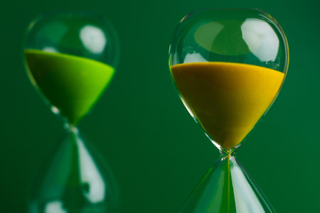 Hourglass The process of time running out The rule of limited timeの写真素材