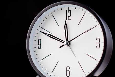 Clocks tell the time of work and life, processes and rules of limited time. Photo of clock in studio.の写真素材