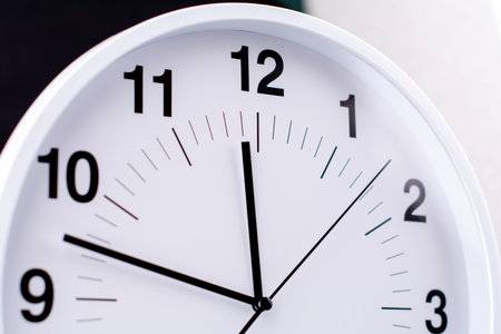 Clocks tell the time of work and life, processes and rules of limited time. Photo of clock in studio.の写真素材