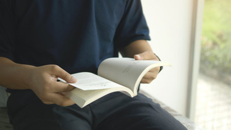 Reading books to enhance knowledge and seek knowledge from the world of books. Learning from silence and relaxation.の写真素材